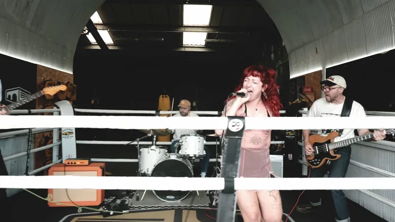 Smoke Mirror video still: the band playing inside a boxing ring